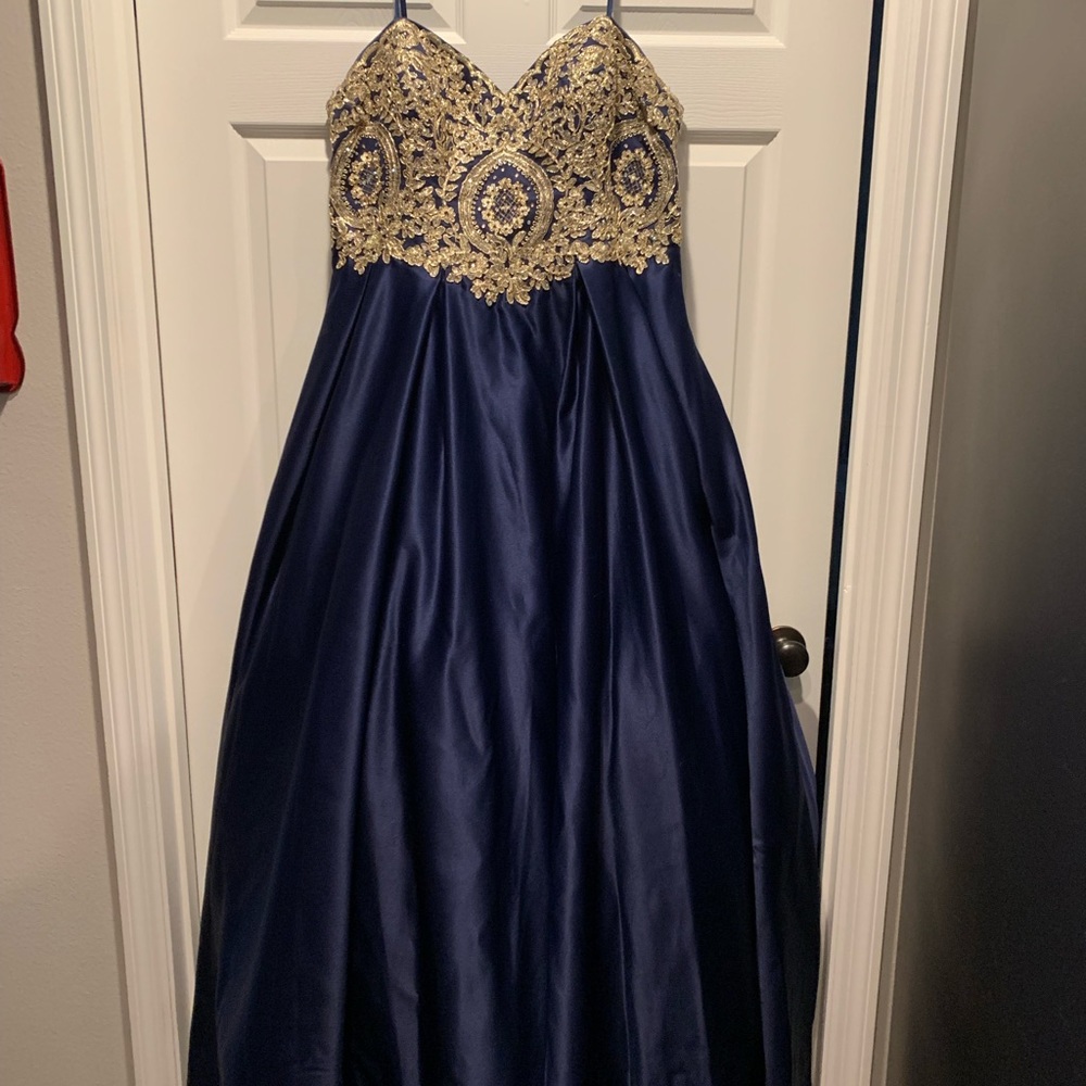 Navy prom dress with golden detailing on bodice